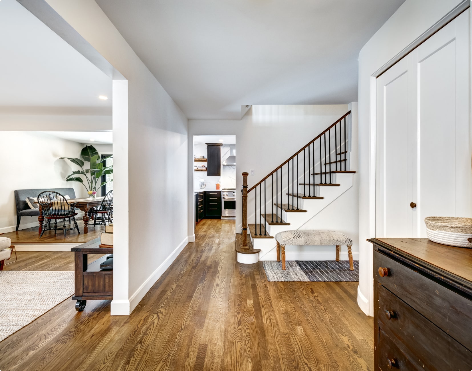 wood flooring in home with staircase